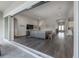 Open-concept living room with wood floors and direct access to the patio at 6915 Sea Stone Ct, Apollo Beach, FL 33572