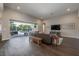 Open living room with wood floors has great view to the backyard pool area at 6915 Sea Stone Ct, Apollo Beach, FL 33572