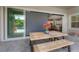 Relaxing outdoor patio with dining area and views of the refreshing pool at 6915 Sea Stone Ct, Apollo Beach, FL 33572