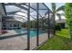 Screened-in pool with outdoor seating, offering a perfect blend of relaxation and recreation at 6915 Sea Stone Ct, Apollo Beach, FL 33572