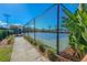 Outdoor sports court fenced and ready for play, surrounded by lush landscaping at 6915 Sea Stone Ct, Apollo Beach, FL 33572