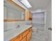 Bathroom featuring neutral colors, wooden cabinets, and a shower with a striped curtain at 6958 68Th N Ave, Pinellas Park, FL 33781