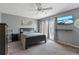 Neutral bedroom featuring a queen bed, dresser, and access to a balcony through French doors at 711 S Oregon Ave, Tampa, FL 33606