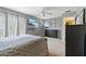 Spacious bedroom with balcony access, TV, ceiling fan, and plenty of closet space at 711 S Oregon Ave, Tampa, FL 33606