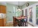 Cozy breakfast nook with table, chairs, and natural light from the glass doors at 711 S Oregon Ave, Tampa, FL 33606