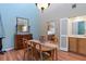 Elegant dining room with wood floors, classic furniture, and view into living area at 711 S Oregon Ave, Tampa, FL 33606