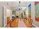 Open dining area with view of the living room, fireplace, and abundant natural light at 711 S Oregon Ave, Tampa, FL 33606