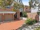 Charming two-story brick home with a brick driveway and a well-kept landscaped yard at 711 S Oregon Ave, Tampa, FL 33606
