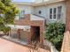 Stylish townhouse showcasing brick and stucco exterior with a two-car garage at 711 S Oregon Ave, Tampa, FL 33606