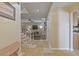 Inviting hallway leads to a cozy living room with stairs and features tiled floors at 711 S Oregon Ave, Tampa, FL 33606