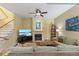 Comfortable living room with fireplace, plush seating, and entertainment center at 711 S Oregon Ave, Tampa, FL 33606