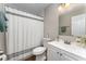 This bathroom features a shower, toilet, mirror, vanity with sink, and wood-look flooring at 712 Hazy Meadow Ct, Brandon, FL 33510