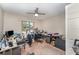 This room features a ceiling fan, neutral walls, a window, and beige carpet flooring at 712 Hazy Meadow Ct, Brandon, FL 33510