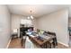 Bright dining area features a stylish chandelier and provides a cozy spot for meals at 712 Hazy Meadow Ct, Brandon, FL 33510
