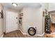Inviting foyer featuring wood flooring and an ornate mirror, with natural light at 712 Hazy Meadow Ct, Brandon, FL 33510