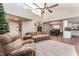 Open living room with vaulted ceilings connecting seamlessly to dining and kitchen areas at 712 Hazy Meadow Ct, Brandon, FL 33510