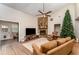 Spacious living room featuring vaulted ceilings and a cozy stone fireplace feature at 712 Hazy Meadow Ct, Brandon, FL 33510