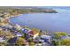 An aerial view showcases the home's waterfront location with a sprawling coastline and gorgeous backyard at 100 Driftwood W Dr, Palm Harbor, FL 34683