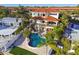 Aerial view of the home's backyard featuring a private pool and lush tropical landscaping at 100 Driftwood W Dr, Palm Harbor, FL 34683