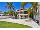 Luxury backyard with pool, patio and green lawn with lush landscaping surrounding the property at 100 Driftwood W Dr, Palm Harbor, FL 34683