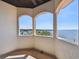 Spacious outdoor balcony overlooking waterfront and offering expansive views at 100 Driftwood W Dr, Palm Harbor, FL 34683