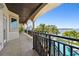 Enjoy the beautiful water view from this balcony with black metal railings and tile flooring at 100 Driftwood W Dr, Palm Harbor, FL 34683