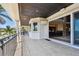 Wide tiled balcony overlooking the water with indoor/outdoor access at 100 Driftwood W Dr, Palm Harbor, FL 34683