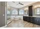 Bathroom with soaking tub, glass shower, dual sinks, and modern finishes at 100 Driftwood W Dr, Palm Harbor, FL 34683