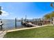 Private waterfront dock provides easy access to open water, perfect for boating, fishing, and scenic sunsets at 100 Driftwood W Dr, Palm Harbor, FL 34683