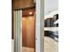 A residential elevator opens into the home, with the kitchen just beyond at 100 Driftwood W Dr, Palm Harbor, FL 34683