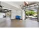 Neat garage with epoxy flooring, showcasing functionality and storage capacity at 100 Driftwood W Dr, Palm Harbor, FL 34683