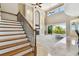 Bright living room with fireplace, large rug and walk out to balcony at 100 Driftwood W Dr, Palm Harbor, FL 34683