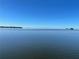 Expansive waterfront view showcasing the serene water on a clear day at 100 Driftwood W Dr, Palm Harbor, FL 34683
