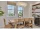 Bright dining room featuring a wine bar and large windows offering great natural light at 1110 Bay Pine Blvd, Indian Rocks Beach, FL 33785