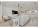 Bright and airy living room with modern decor, ceiling fan and open floor plan in Indian Rocks Beach at 1110 Bay Pine Blvd, Indian Rocks Beach, FL 33785