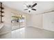 This bedroom offers sliding glass doors, sliding barn door and custom shelving at 1220 Parkview Ln, Largo, FL 33770