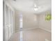 Bright bedroom with neutral walls, ceiling fan and closet providing lots of light at 1220 Parkview Ln, Largo, FL 33770