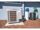 Exterior shot showcasing the home's air conditioning unit and water filtration system at 1220 Parkview Ln, Largo, FL 33770