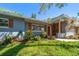 Charming single-story home with well-maintained lawn, colorful landscaping, and a welcoming entrance at 1220 Parkview Ln, Largo, FL 33770