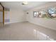 Spacious living room with beautiful floors, natural light, and a view of the front yard at 1220 Parkview Ln, Largo, FL 33770