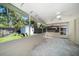 View of the covered patio with tiled floor, ceiling fan, and view of the backyard at 1220 Parkview Ln, Largo, FL 33770