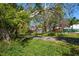 View of street with mature trees and greenery at 1220 Parkview Ln, Largo, FL 33770