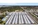 Wide aerial shot of a sprawling mobile home park with well-maintained landscaping and community pool on a sunny day at 12400 Park Blvd # 408, Seminole, FL 33772