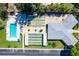 Aerial view of community amenities, including a pool, bocce ball, and shuffleboard courts at 12400 Park Blvd # 408, Seminole, FL 33772