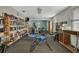 Community area with books and fitness equipment offering residents leisure and workout options at 12400 Park Blvd # 408, Seminole, FL 33772