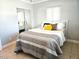 Cozy bedroom features tile flooring, a mirrored closet, and natural light from the window at 12400 Park Blvd # 408, Seminole, FL 33772