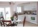 Bright kitchen with white cabinets, stainless appliances, and eat-in table at 12400 Park Blvd # 408, Seminole, FL 33772