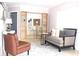 Inviting living room featuring a comfortable couch and stylish shelving at 12400 Park Blvd # 408, Seminole, FL 33772