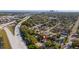 Aerial shot of a property near a highway, with a cityscape visible on the horizon at 1426 Erie S St, St Petersburg, FL 33712