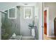 Updated bathroom with a sleek vanity, modern fixtures, and glass enclosed shower at 14910 Northwood Village Ln, Tampa, FL 33613